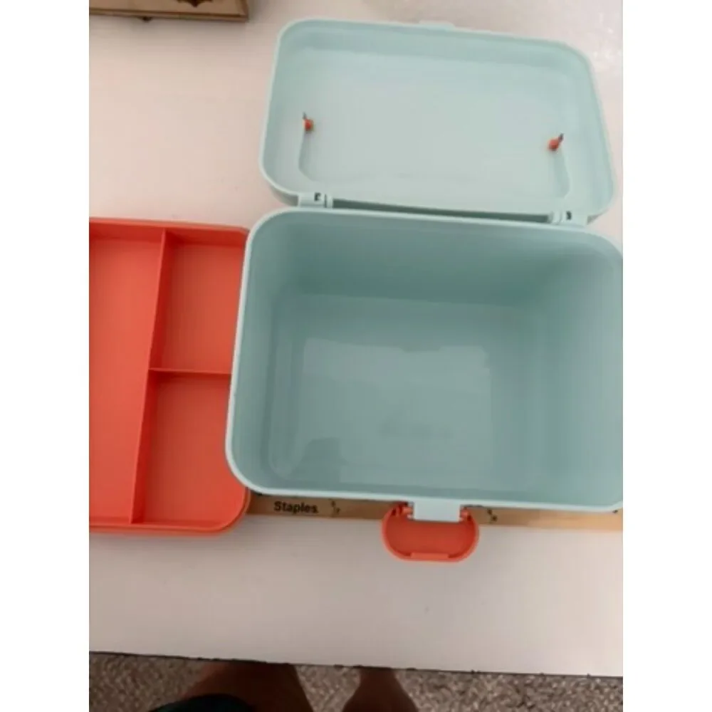 Modern portable plastic medicine box with orange handle and latch